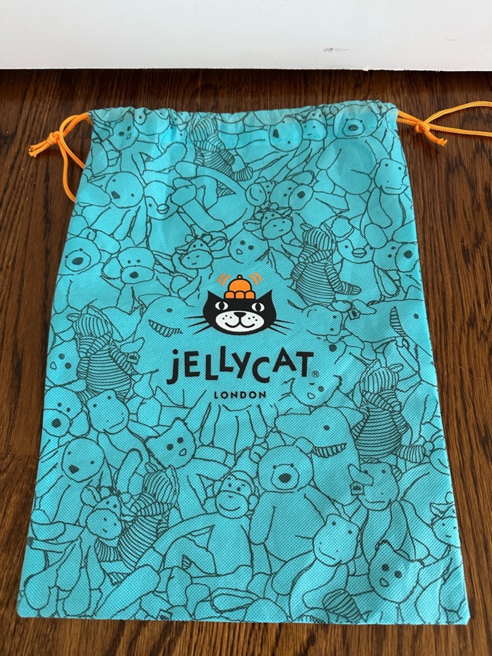 Jellycat Aqua Drawstring Pouch with Orange Accents
